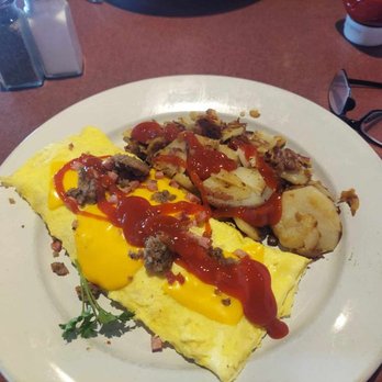 Rosie’s Breakfast Cafe - Meat Lovers Omelet With Home Fries & Rye Toast - Breakfast & Brunch Near Me - Fort Myers, Florida Rosie’s Breakfast Cafe - Meat Lovers Omelet With Home Fries & Rye Toast - Breakfast & Brunch Near Me - Fort Myers, Florida