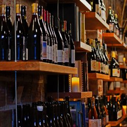 J and J Wine Merchants - Friendly, informed descriptions available for the inventory displayed on the left wall