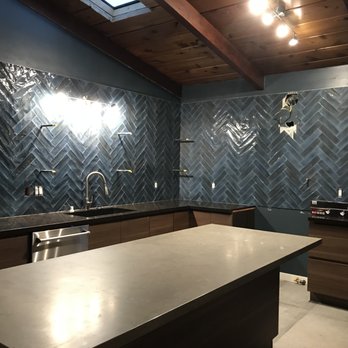 S H Construction & Remodeling - a man standing in a kitchen - General Contractors Near Me - San Diego, California S H Construction & Remodeling - a man standing in a kitchen - General Contractors Near Me - San Diego, California