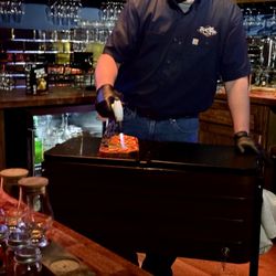 Sugarlands Distilling Co - Hidden Stave torching oranges for the old fashioned drinks