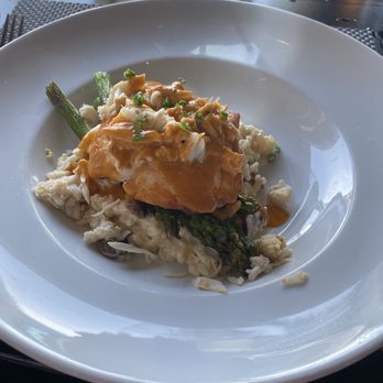 The Bay House - Gulf black grouper with oven roasted, andouille-mushroom risotto, jumbo lump crab, asparagus, and charred tomato vinaigrette. - Seafood Near Me - Naples, Florida