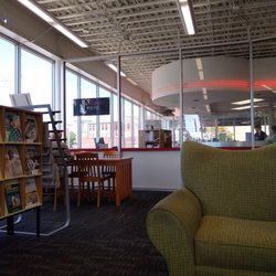 Boonslick Regional Library - Big Comfy chairs glass partition to cut noise and cold AC on a hot day