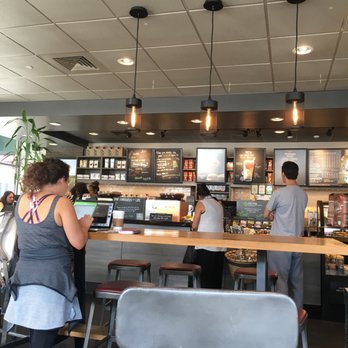 Starbucks - customers at the counter of a coffee shop - Coffee & Tea Near Me - Fairfax, Virginia Starbucks - customers at the counter of a coffee shop - Coffee & Tea Near Me - Fairfax, Virginia