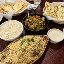 Lamb biryani, garlic naan Lamb biryani, garlic naan