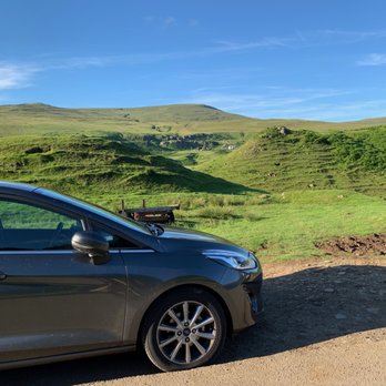 Fairy Glen - My rental car parked beside the road, on the left, and a tiered hill/rocks beyond on the right. - Landmarks & Historical Buildings Near Me