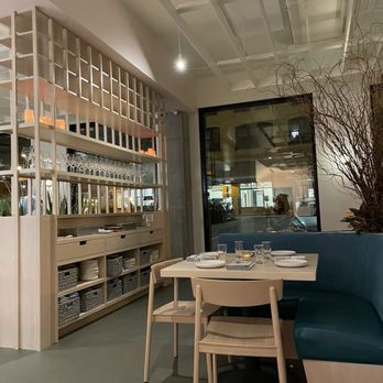 Dario - a dining area with a table and chairs - Italian Near Me - Minneapolis, Minnesota