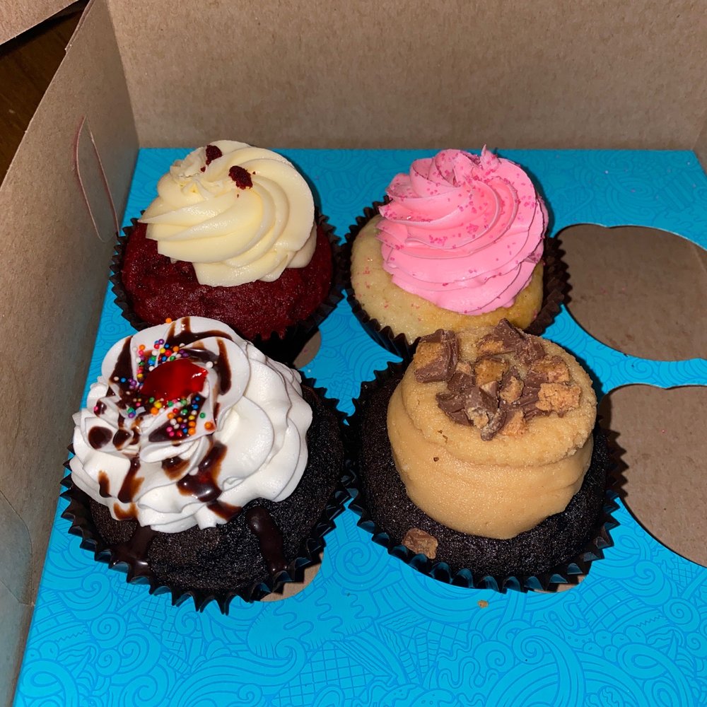a variety of cupcakes in a box a variety of cupcakes in a box