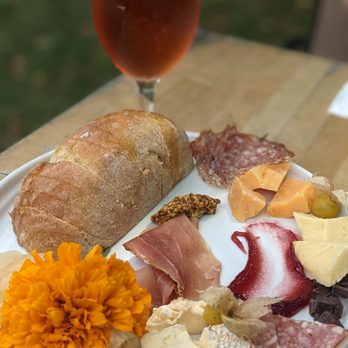 Rockmill Brewery - Cheese & charcuterie board (9/18/2021), with a cerise in the background. - Breweries Near Me - Lancaster, Ohio Rockmill Brewery - Cheese & charcuterie board (9/18/2021), with a cerise in the background. - Breweries Near Me - Lancaster, Ohio