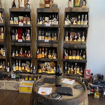 Revival Vintage Bottle shop - Part of their vintage bottle selection - Whiskey Bars Near Me - Covington, Kentucky