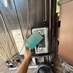Certified Appliance Repair - GE refrigerator taking a lightning surge to the main control board.