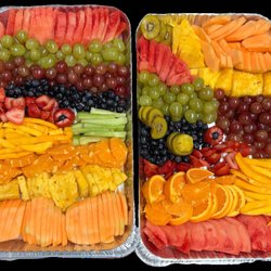 Our catering fruit lover trays, includes grapes, watermelon, strawberries, kiwi, oranges, & mangos.