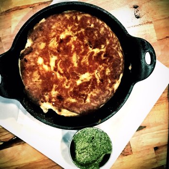The Noble South - cornbread filled with cracklins and collard green butter....outstanding. - New American Near Me - Mobile, Alabama The Noble South - cornbread filled with cracklins and collard green butter....outstanding. - New American Near Me - Mobile, Alabama