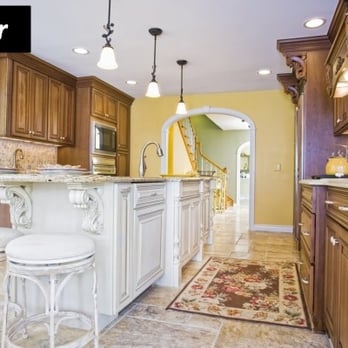 Lincorp/Borchert - White painted island with Cherry cabinets from Bishop Cabinetry - General Contractors Near Me - Washington, Michigan