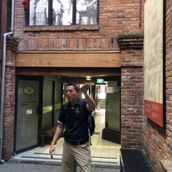 A Taste of Victoria Food Tours - Andy explaining the history of Fan Tan alley in Chinatown.