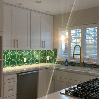 Royal Kitchen and Flooring - The new remodeled kitchen with under the cabinet lights on. - General Contractors Near Me - Thousand Oaks, California