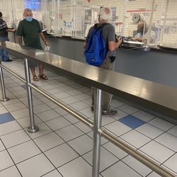 US Post Office - Long Line; 2 workers.
