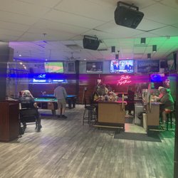 Pool tables in bar.