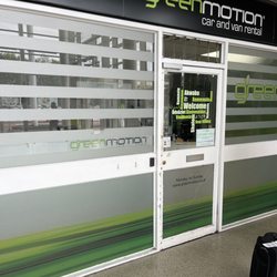 Green Motion Car and Van Rental - 11AM and the doors are closed. The attendant is out vacuuming cars