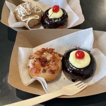 Craft Donuts & Coffee - South - 2 Boston Creams, a tiramisu, and a maple bacon - Donuts Near Me - Santa Fe, New Mexico Craft Donuts & Coffee - South - 2 Boston Creams, a tiramisu, and a maple bacon - Donuts Near Me - Santa Fe, New Mexico