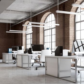 Stars and Stripes Lighting - Commercial LED linear pendant lights illuminating an open office workspace with modern desks and computer stations - Lighting Fixtures & Equipment Near Me - Austin, Texas Stars and Stripes Lighting - Commercial LED linear pendant lights illuminating an open office workspace with modern desks and computer stations - Lighting Fixtures & Equipment Near Me - Austin, Texas