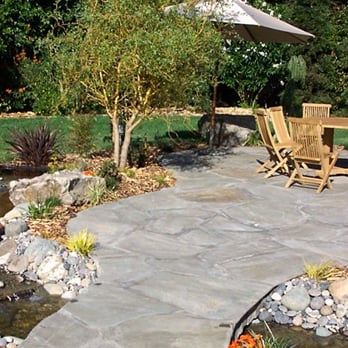 Masterpiece Gardens & Design - a patio with a table and chairs - Landscaping Near Me - Daly City, California Masterpiece Gardens & Design - a patio with a table and chairs - Landscaping Near Me - Daly City, California