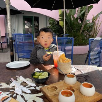 La Guerrerense - They have a flight of salsas you can try. This guy got hit with a spicy one! - Food Stands Near Me - Ensenada, BCN