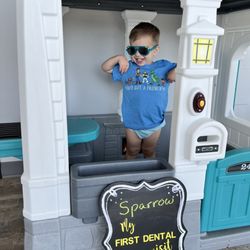 Cypress Pediatric Dentistry - My son with the cute sign they provided for our photo'