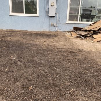 Sod & Turf Pros - After: A minimum 6" step up from the patio onto the dirt created a potential flooding of the patio. - Landscaping Near Me Sod & Turf Pros - After: A minimum 6" step up from the patio onto the dirt created a potential flooding of the patio. - Landscaping Near Me