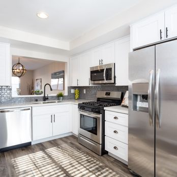 Square Construction - a kitchen with stainless steel appliances - General Contractors Near Me Square Construction - a kitchen with stainless steel appliances - General Contractors Near Me