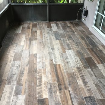 David's Tile - a patio with wood flooring - General Contractors Near Me - Winter Springs, Florida