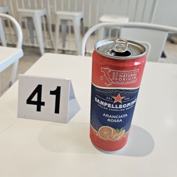Sonny's Mediterranean - SanPellegrinno Aranciata Rosso with table sign - Mediterranean Near Me - Denver, Colorado
