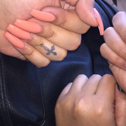 2 full sets with gel polish. Matte top coat used on the nails to the right
