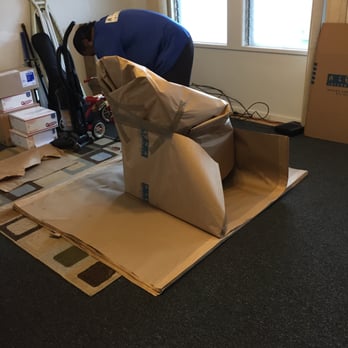 Aloha International Moving Service - wrapping the rocking chair - Movers Near Me - Kapolei, Hawaii Aloha International Moving Service - wrapping the rocking chair - Movers Near Me - Kapolei, Hawaii