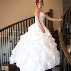 Caleb Woodland Photography - Bride in wedding dress on a staircase.