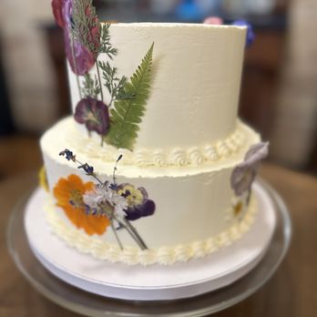 Wildflour - Vanilla on vanilla wedding cake decorated with dried pressed edible flowers - Bubble Tea Near Me - Cadillac, Michigan Wildflour - Vanilla on vanilla wedding cake decorated with dried pressed edible flowers - Bubble Tea Near Me - Cadillac, Michigan
