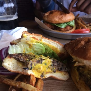 Blatt Beer & Table - Veggie Burger (with the Dixie-Fried Chicken Sandwich in the background). - Gastropubs Near Me - Omaha, Nebraska Blatt Beer & Table - Veggie Burger (with the Dixie-Fried Chicken Sandwich in the background). - Gastropubs Near Me - Omaha, Nebraska