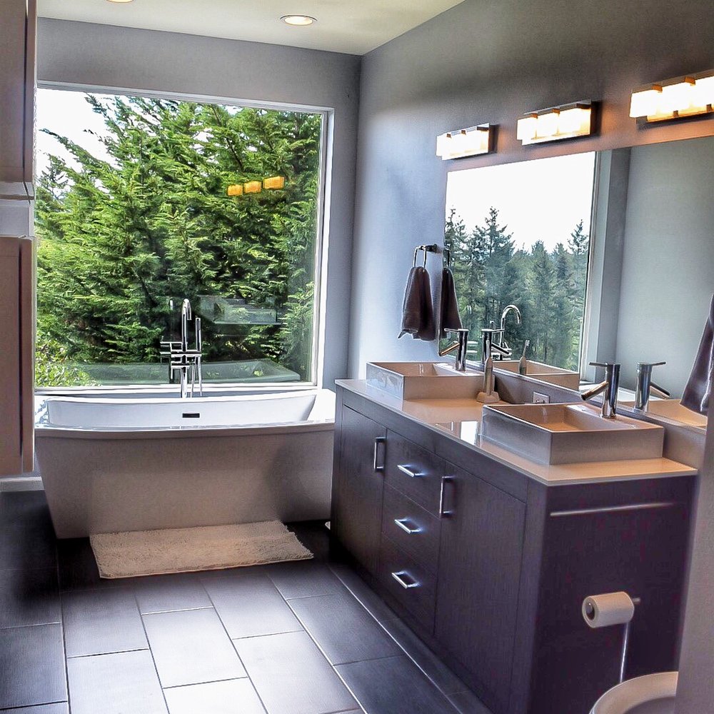 Finish Cuts Construction - a bathroom with a large window - General Contractors Near Me Finish Cuts Construction - a bathroom with a large window - General Contractors Near Me