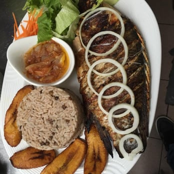 L'Escape - Our world renowned Grilled Fish. Served with Rice, Plantain and Green Salad. - Caribbean Near Me - Montreal, Quebec L'Escape - Our world renowned Grilled Fish. Served with Rice, Plantain and Green Salad. - Caribbean Near Me - Montreal, Quebec