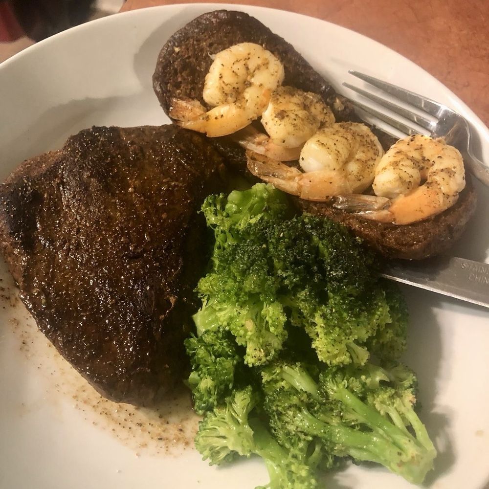 Sirloin steak, steamed broccoli, and shrimp on bar