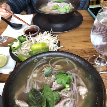 Ginger and Lemongrass - My pho (in the forehand of the photo) - Vietnamese Near Me - Whitestone, New York