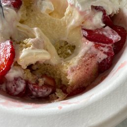 a strawberry shortcake with whipped cream and strawberries a strawberry shortcake with whipped cream and strawberries