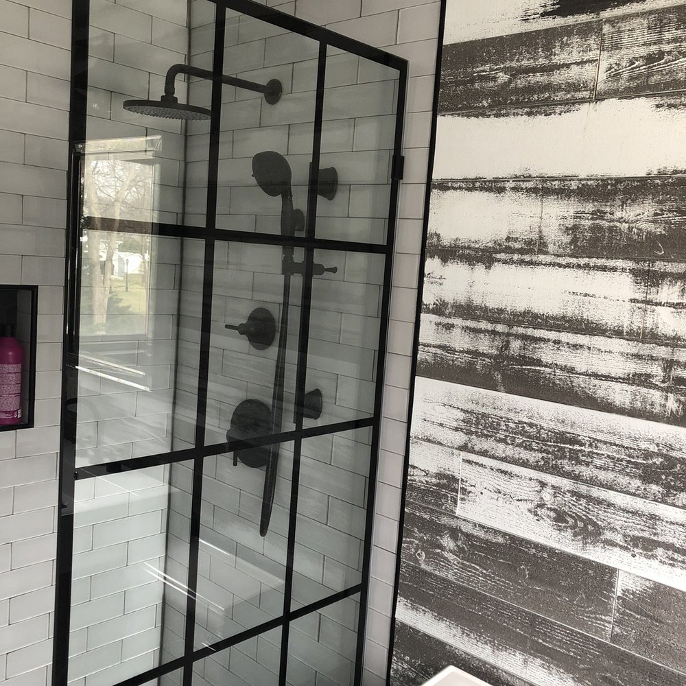 a shower with a glass door a shower with a glass door