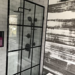 a shower with a glass door a shower with a glass door