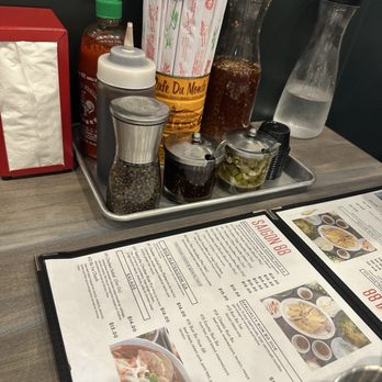 Saigon 88 - Spices and menu. I love that they have a jar of Nước mắm!! - Vietnamese Near Me - Sacramento, California