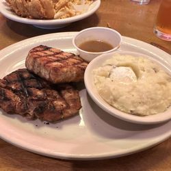 Two pork chops and mashed potatoes