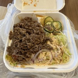 a meal in a styrofoam container