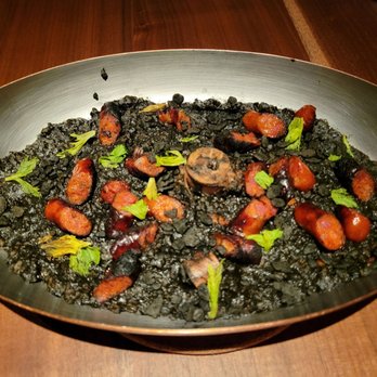 Bar Moro - Arroz Negro Cremoso: squid ink rice porridge, chorizo, braised octopus, celery leaf - Spanish Near Me - Clayton, Missouri Bar Moro - Arroz Negro Cremoso: squid ink rice porridge, chorizo, braised octopus, celery leaf - Spanish Near Me - Clayton, Missouri