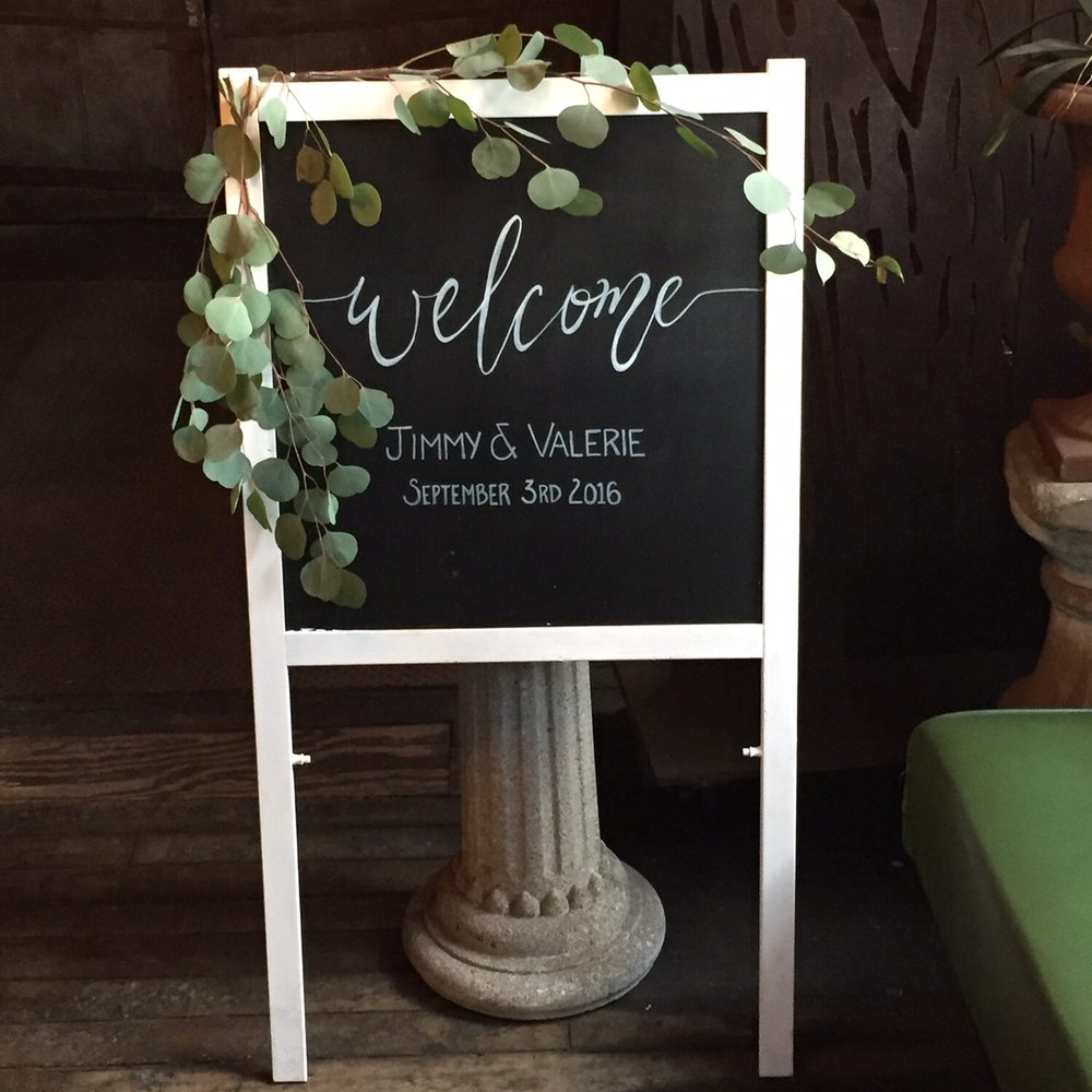 Fifty Flowers - Eucalyptus on welcome sign - Floral Designers Near Me Fifty Flowers - Eucalyptus on welcome sign - Floral Designers Near Me