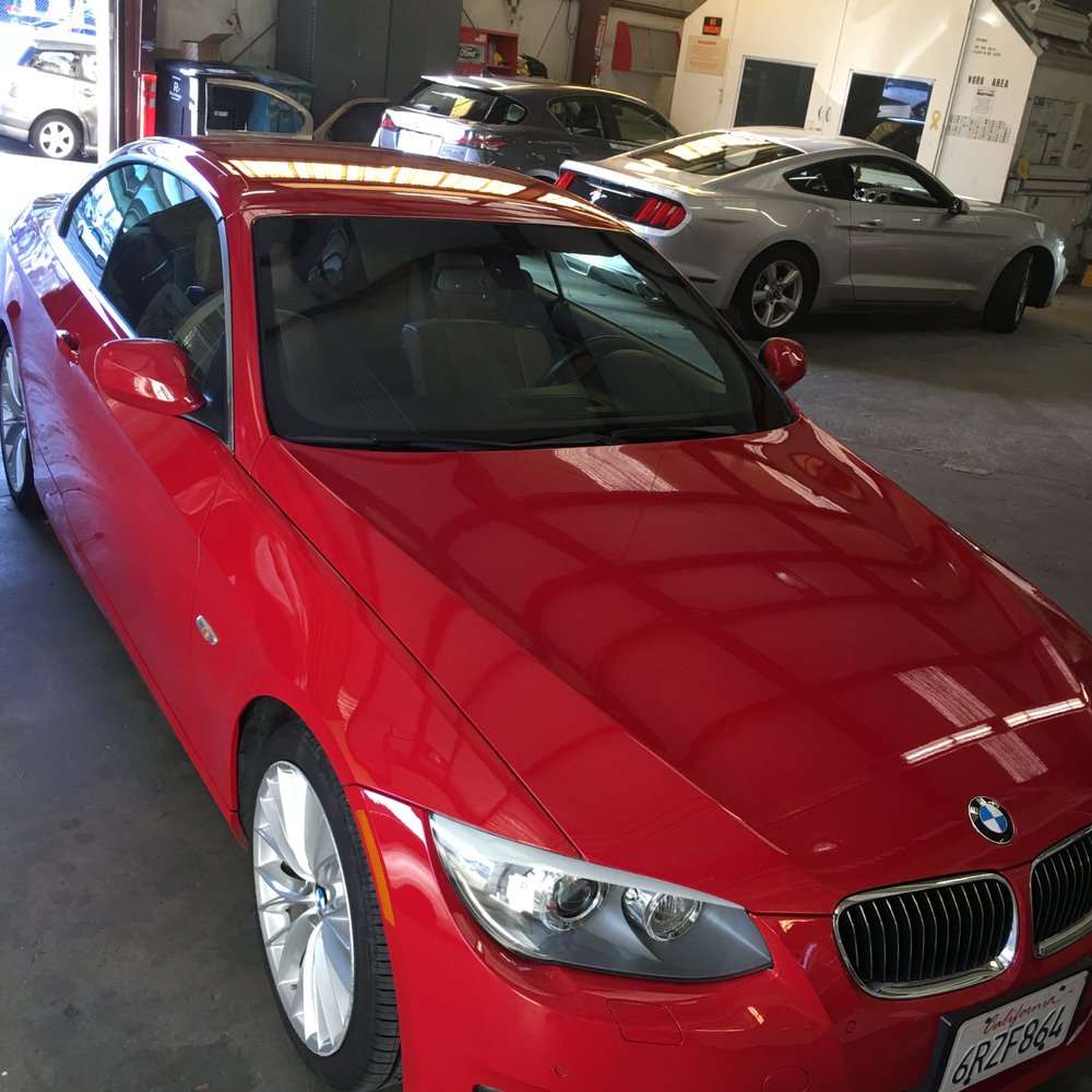 Red BMW 335i completely mint after front bumper work, and water pump replacement by Dennis at Autobody Spa!