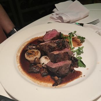 The Capital Grille - Sliced Filet Mignon with Cipollini Onions, Wild Mushrooms and Fig Essence - Steakhouses Near Me - Paramus, New Jersey The Capital Grille - Sliced Filet Mignon with Cipollini Onions, Wild Mushrooms and Fig Essence - Steakhouses Near Me - Paramus, New Jersey